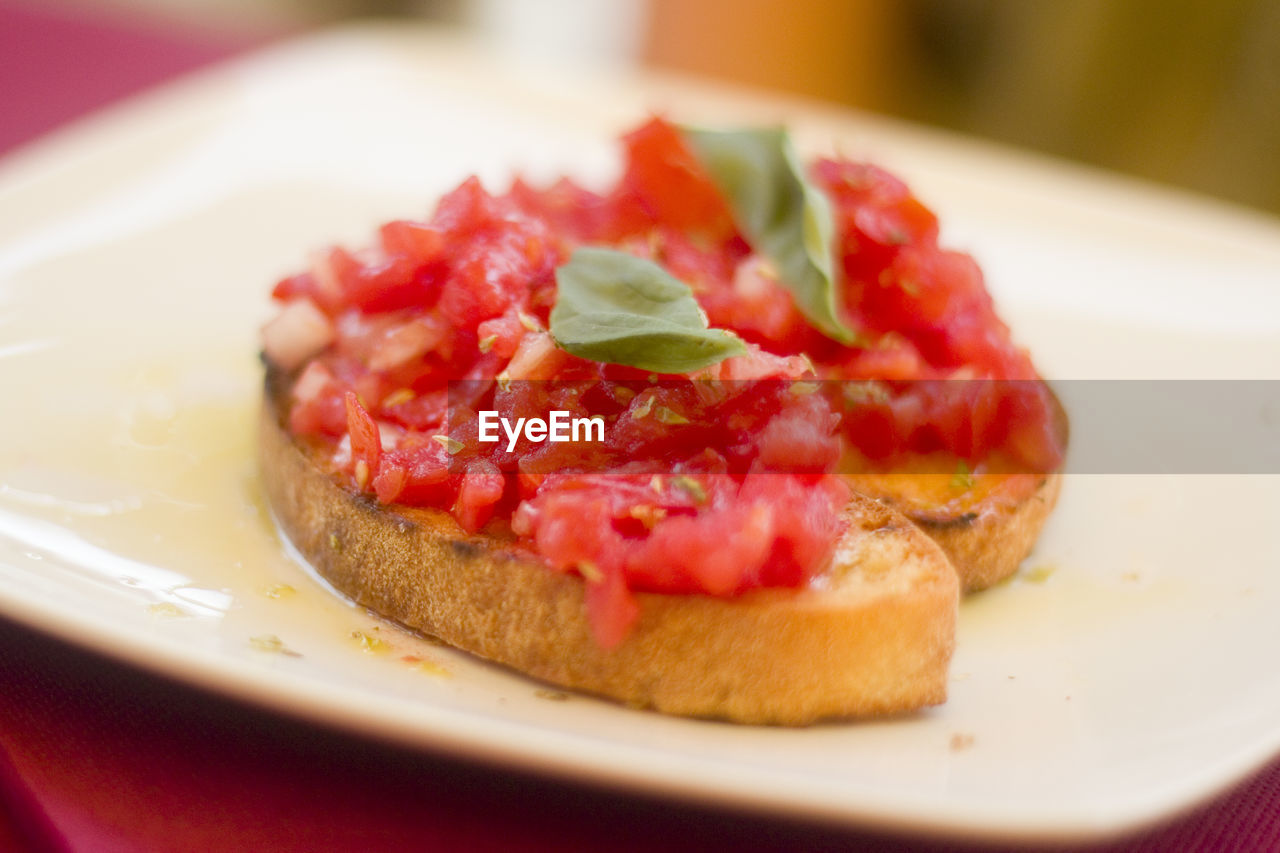 Close-up of bruschetta in plate on table