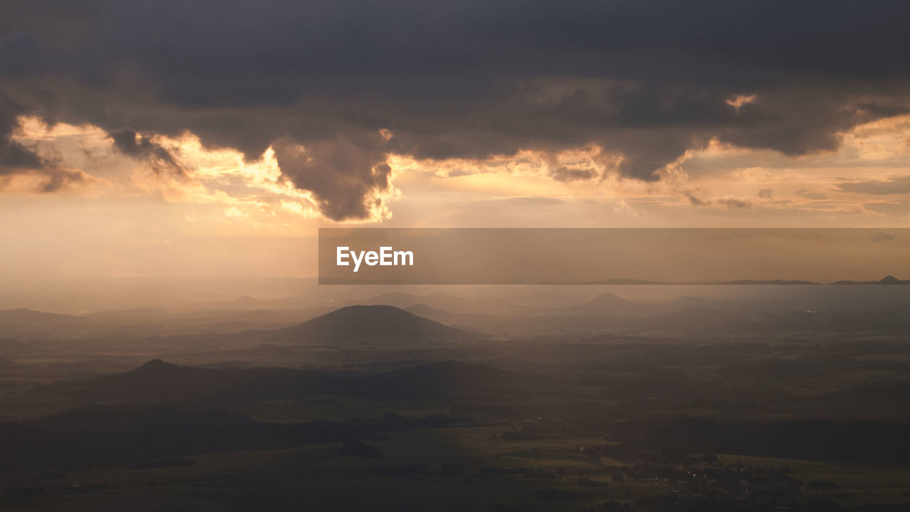 Scenic view of landscape against sky during sunset