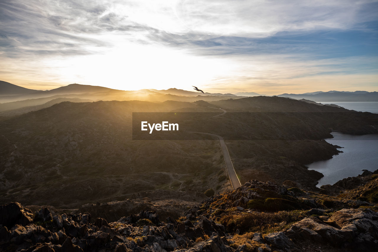 Scenic view of mountain against sky during sunset