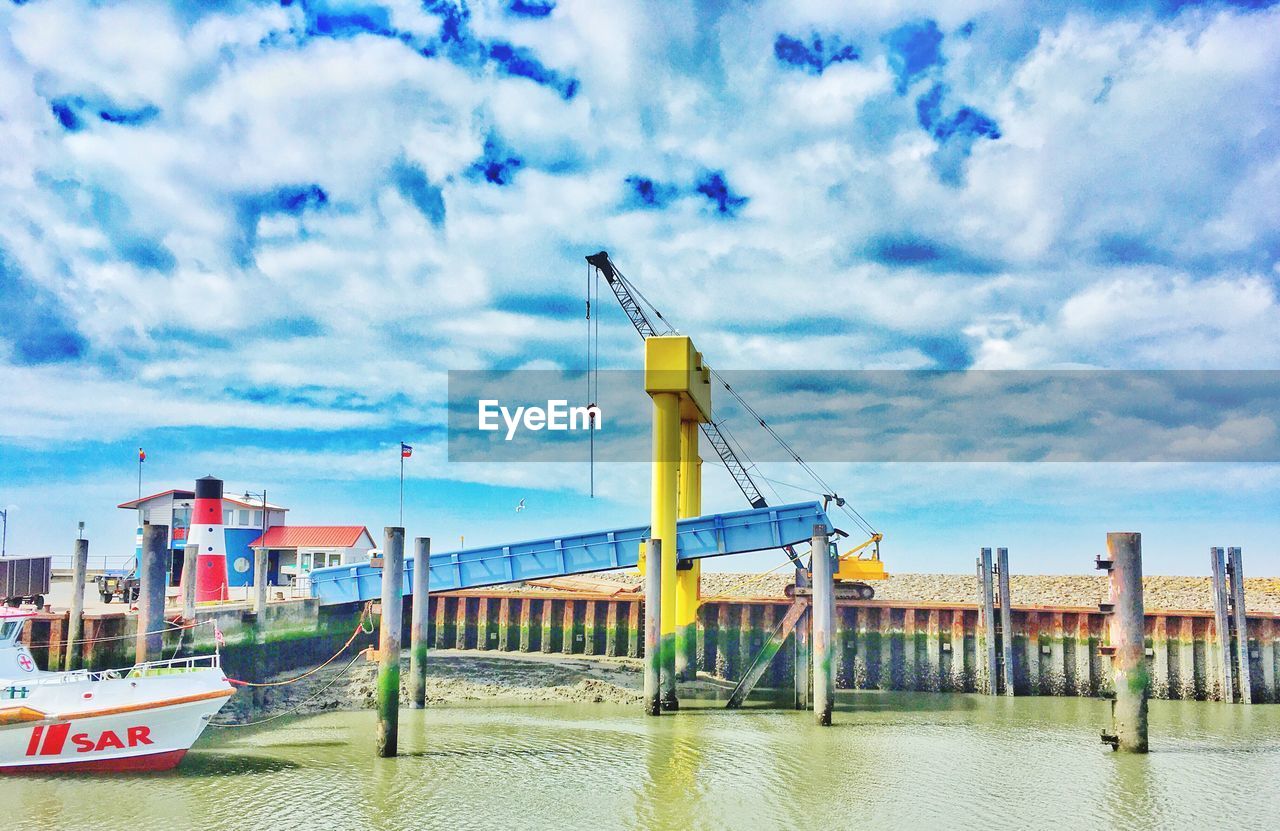 PIER ON SEA AGAINST SKY