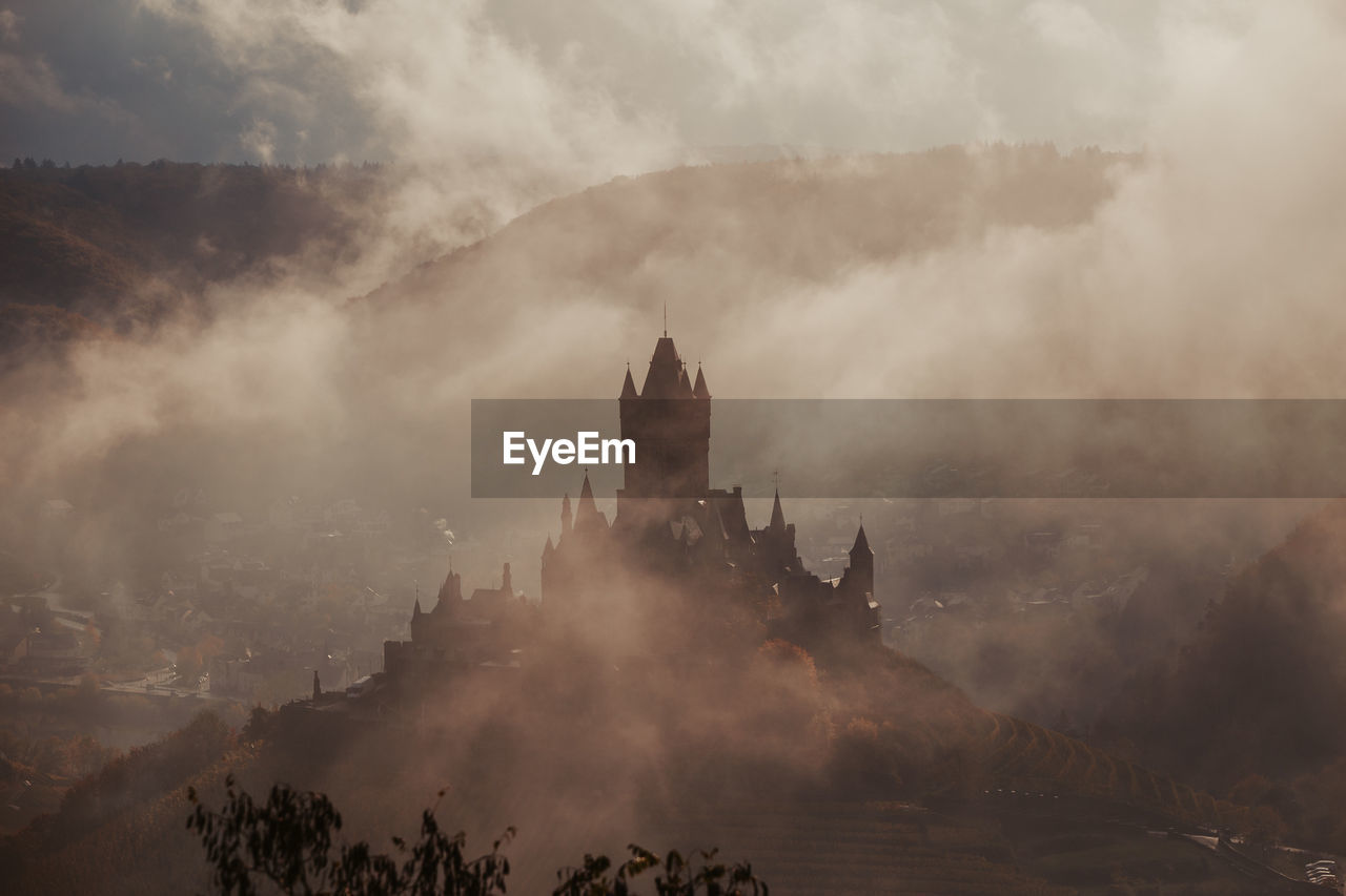 PANORAMIC VIEW OF BUILDINGS IN FOGGY WEATHER