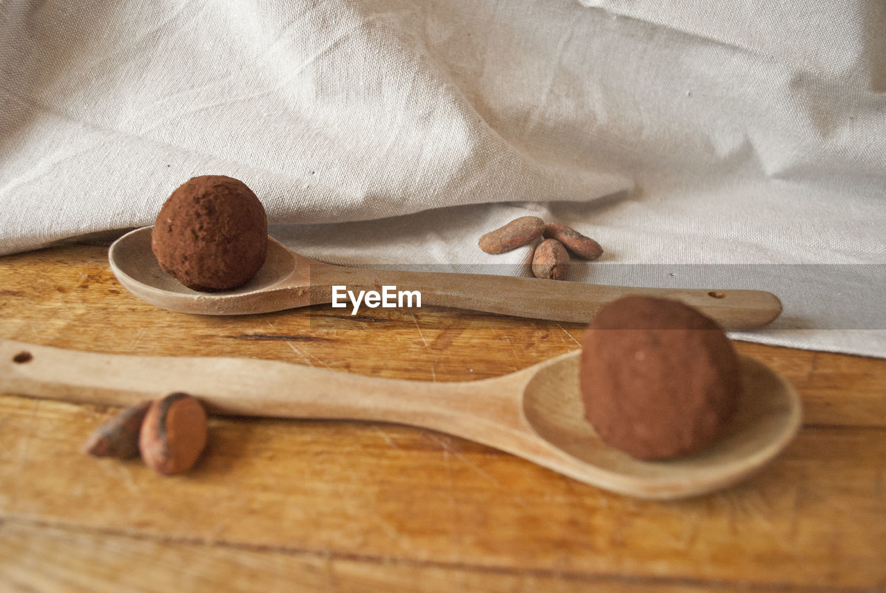 Chocolate energy ball, full of protein and healthy fats. sweet snack on wood board