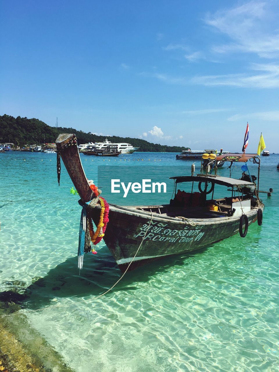 FISHING BOAT IN SEA AGAINST SKY