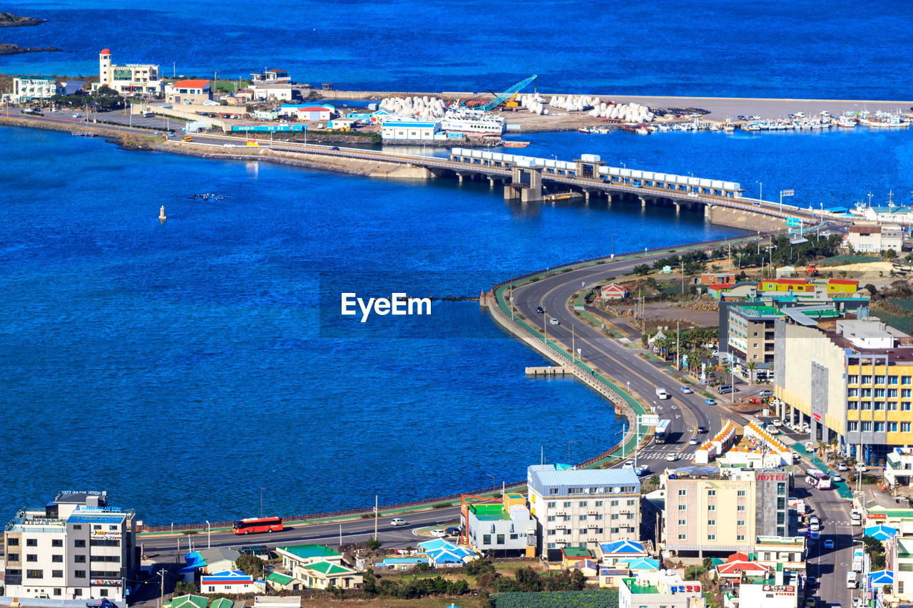 HIGH ANGLE VIEW OF CITYSCAPE AT HARBOR