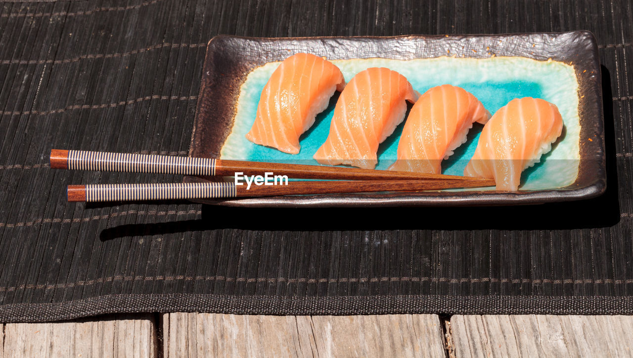 Close-up of sushi in tray on table