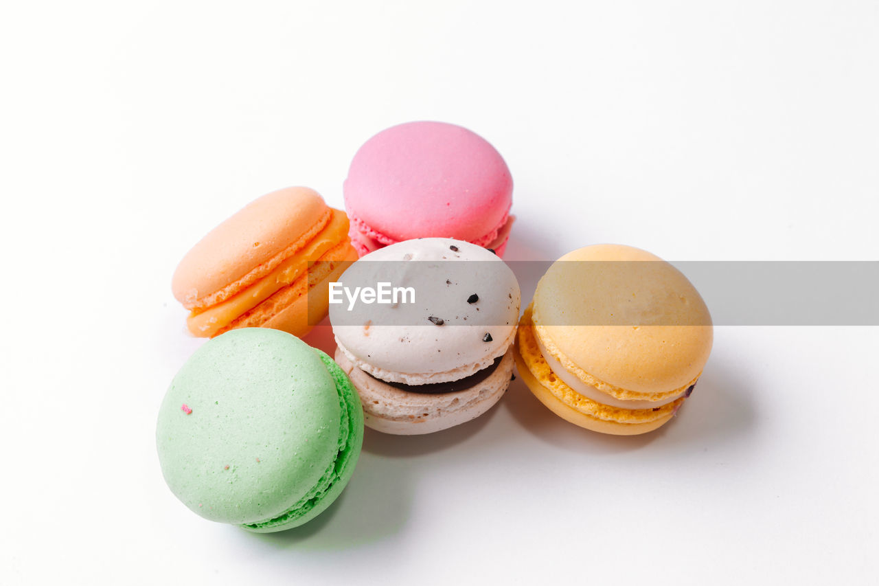 Close-up of macaroons on white background