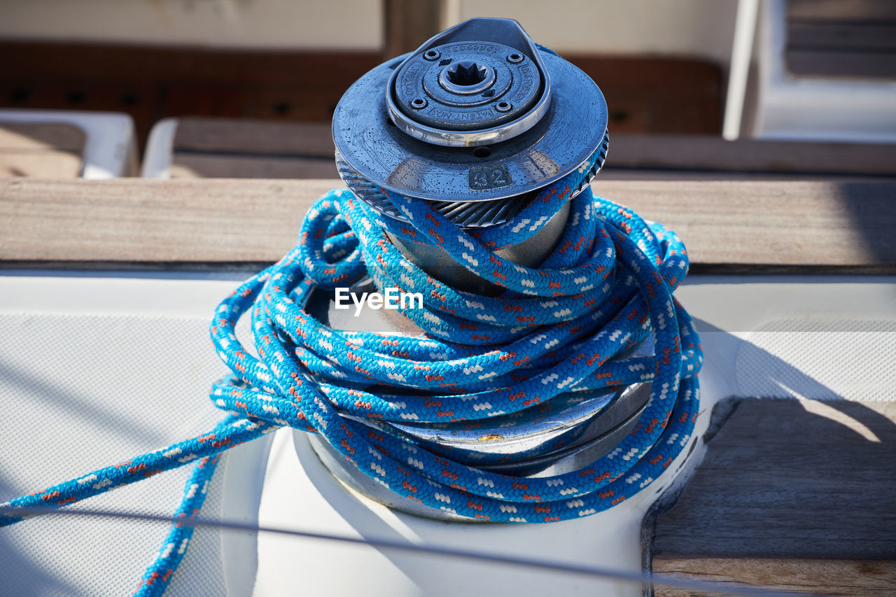 Close-up of blue rope, rolled on a boat, greece