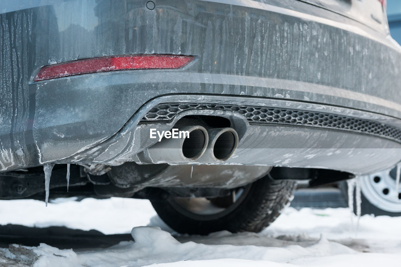 Close-up of frozen car during winter