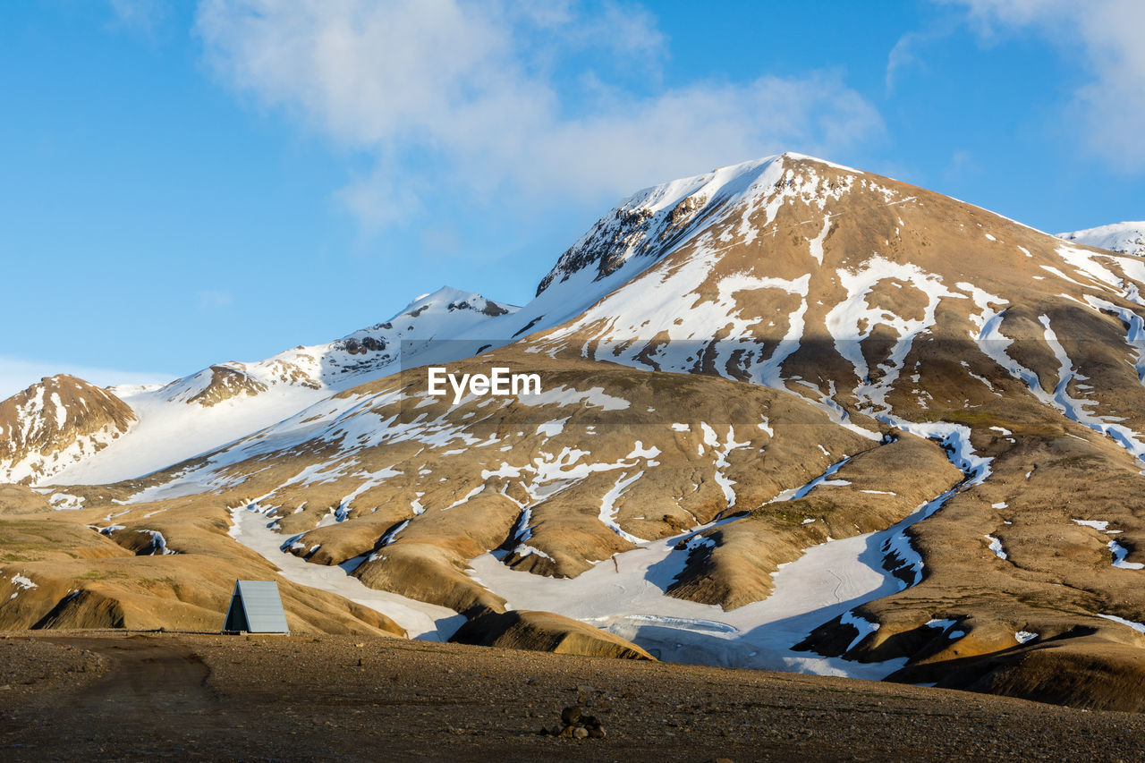 Snowed mountains against the sky