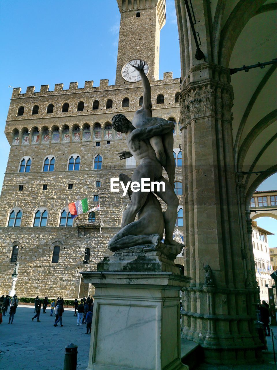 Low angle view of statue against historic building