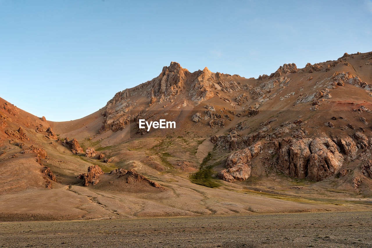 Scenic view of desert against clear sky