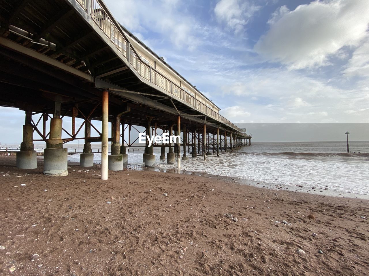 Pier over sea against sky