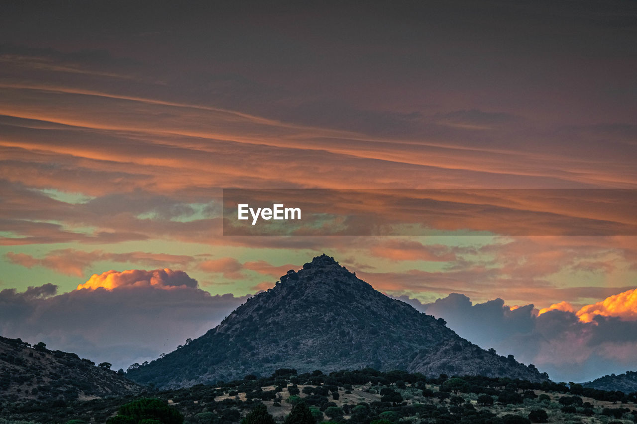 SCENIC VIEW OF MOUNTAINS DURING SUNSET