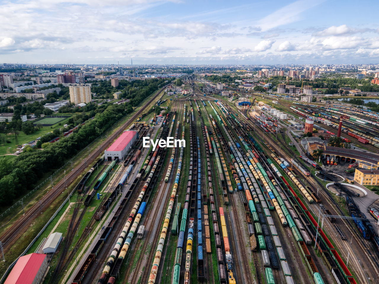 Aerial photo of railway terminal. freight wagons with goods on railroad station. cargo transport