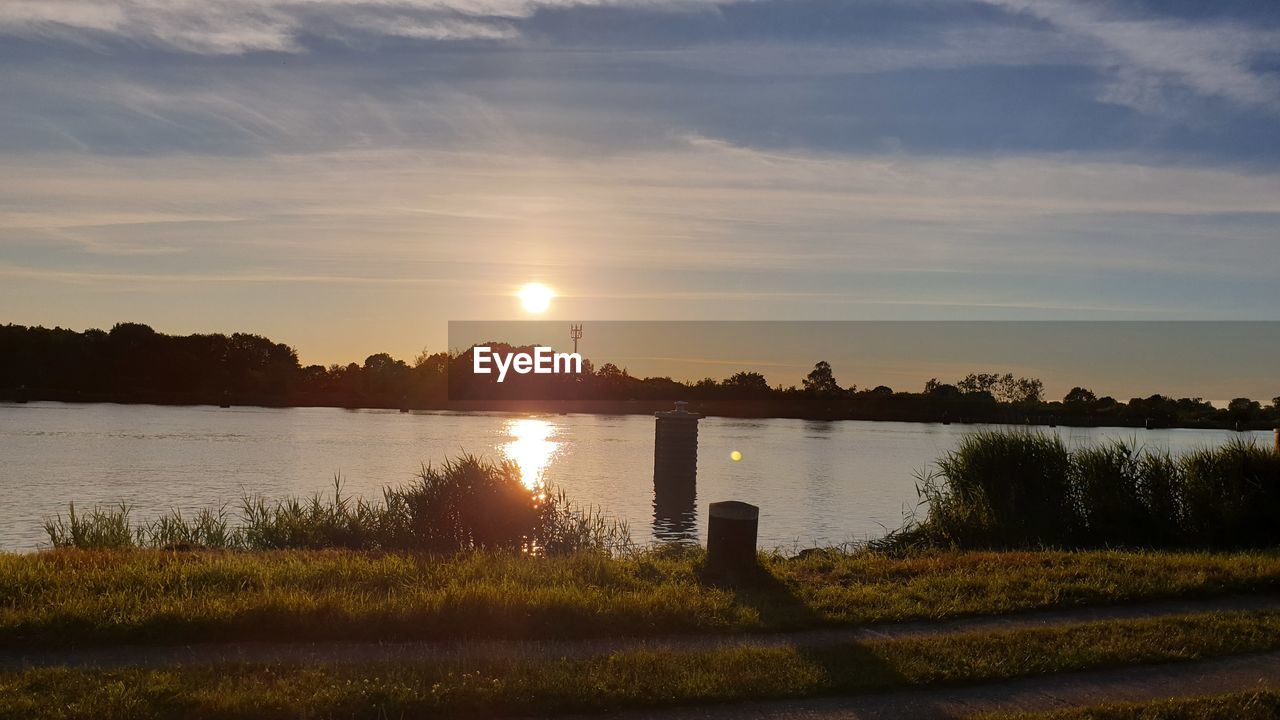 LAKE AGAINST SKY DURING SUNSET