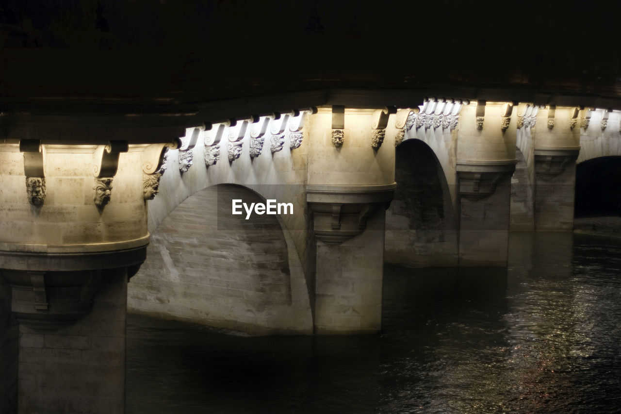 Pont neuf over seine river at night