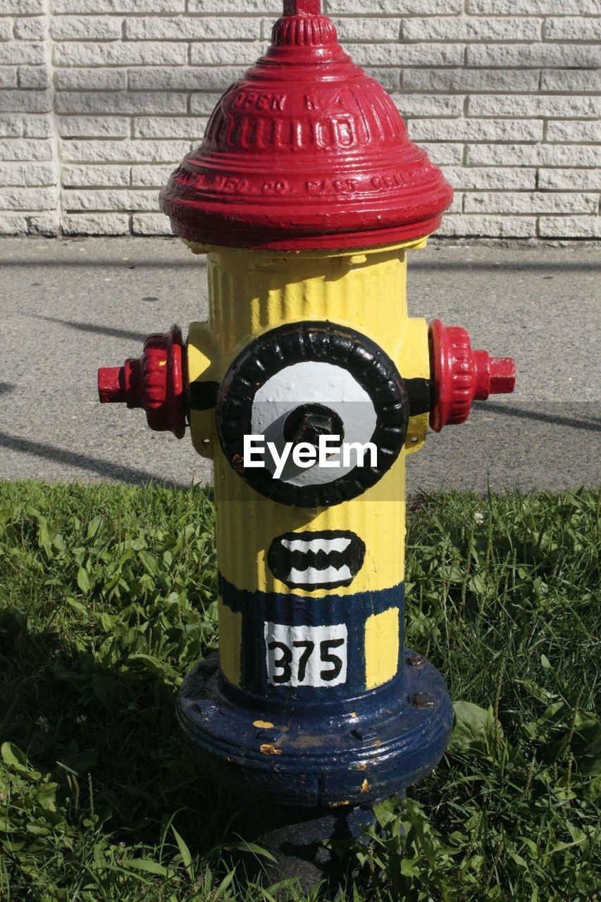 CLOSE-UP OF RED FIRE HYDRANT