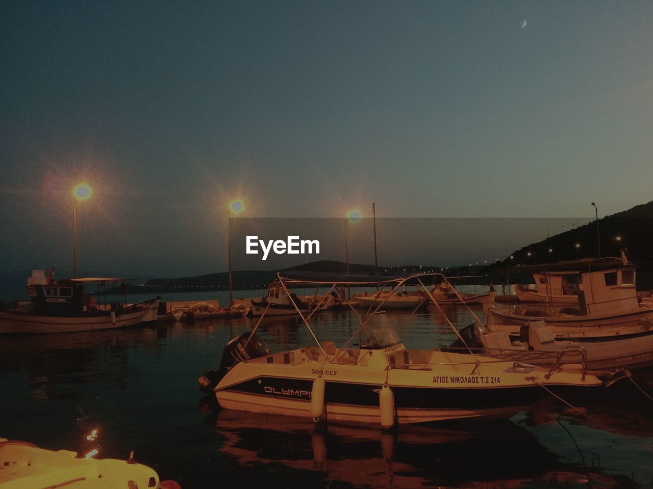 BOATS MOORED IN HARBOR