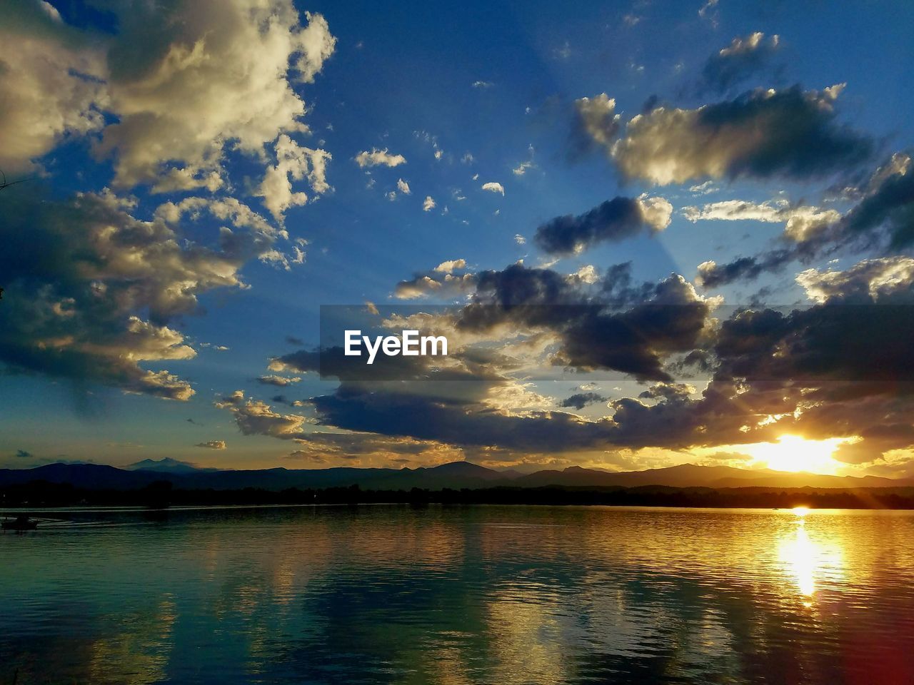 Scenic view of lake against sky during sunset