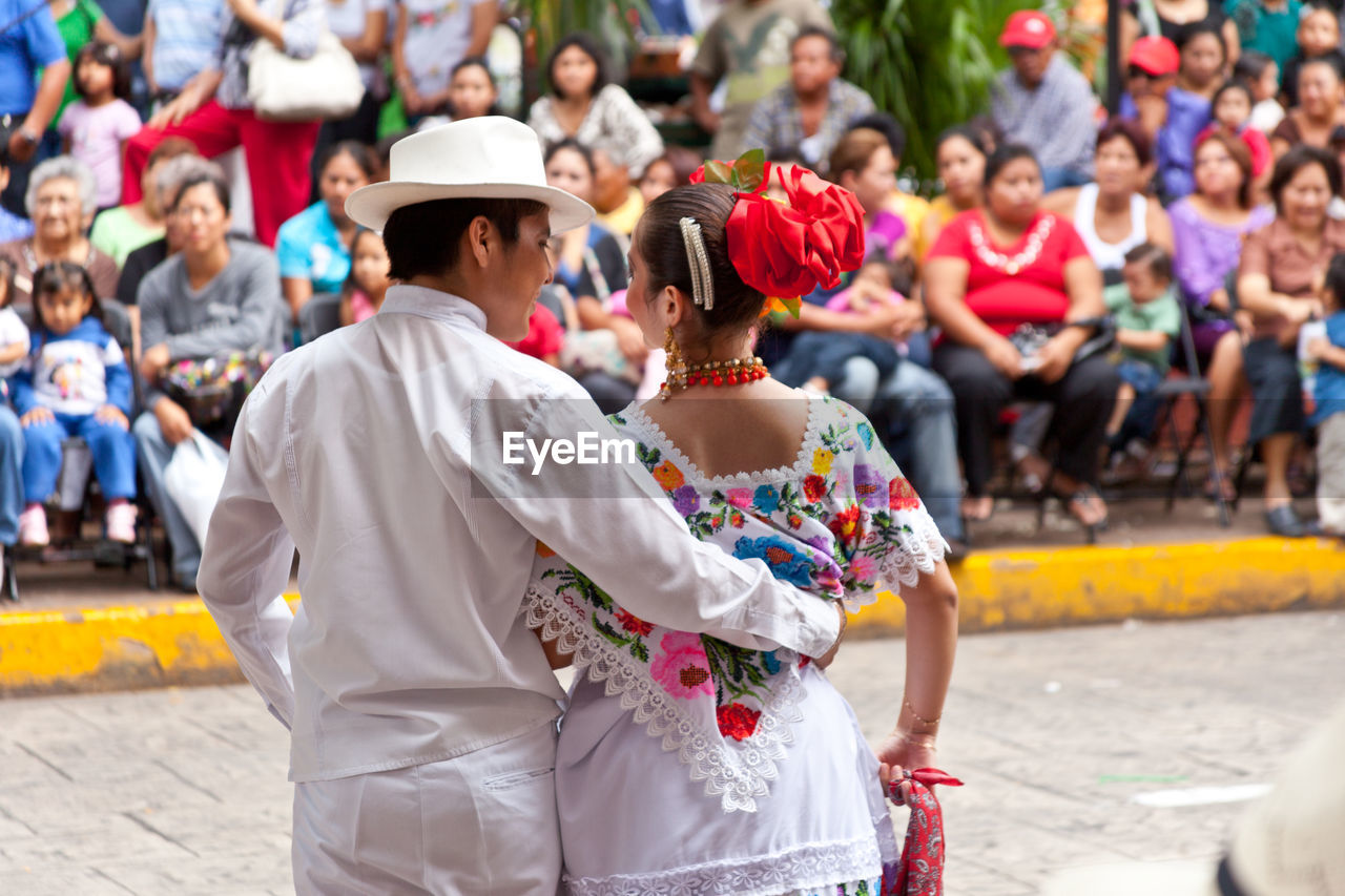 GROUP OF PEOPLE ON STREET