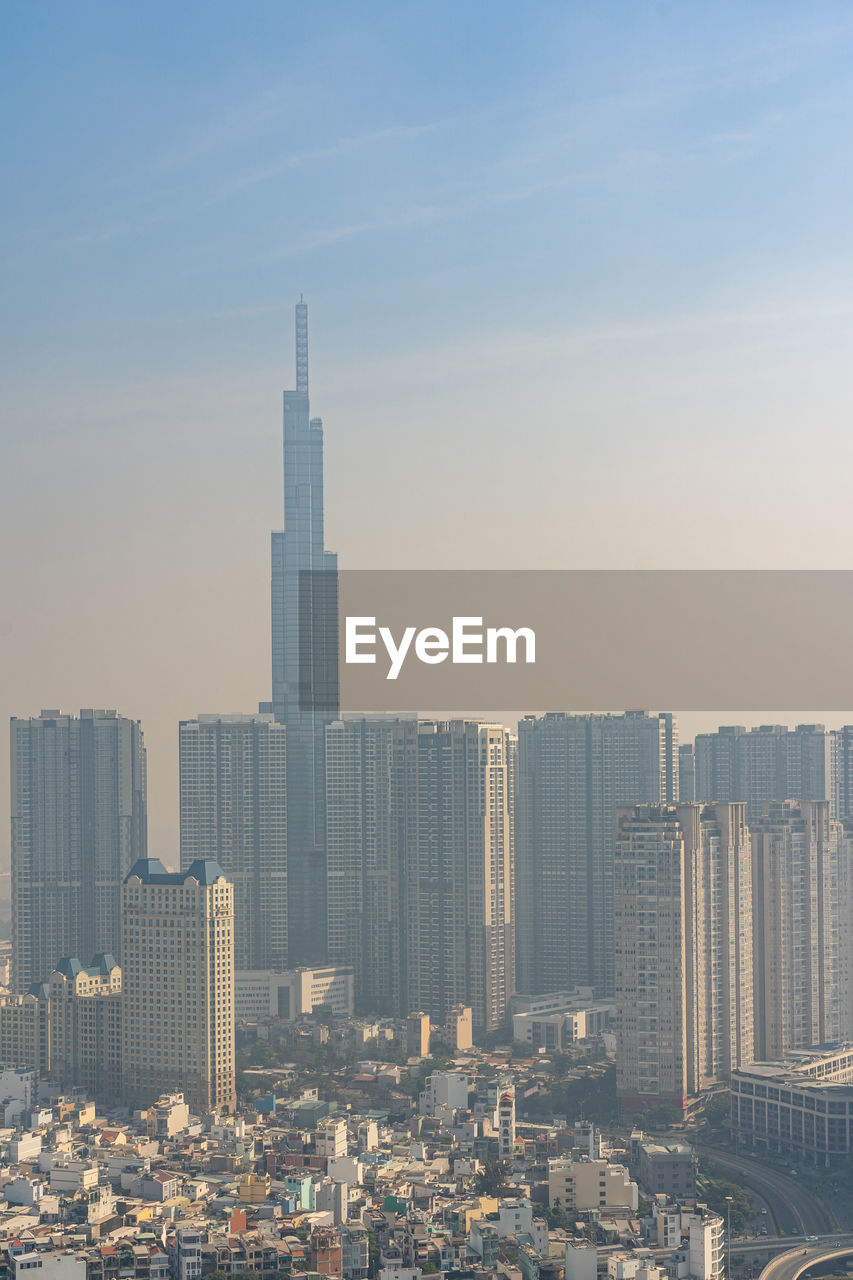 MODERN BUILDINGS AGAINST SKY IN CITY AGAINST CLEAR BLUE BACKGROUND