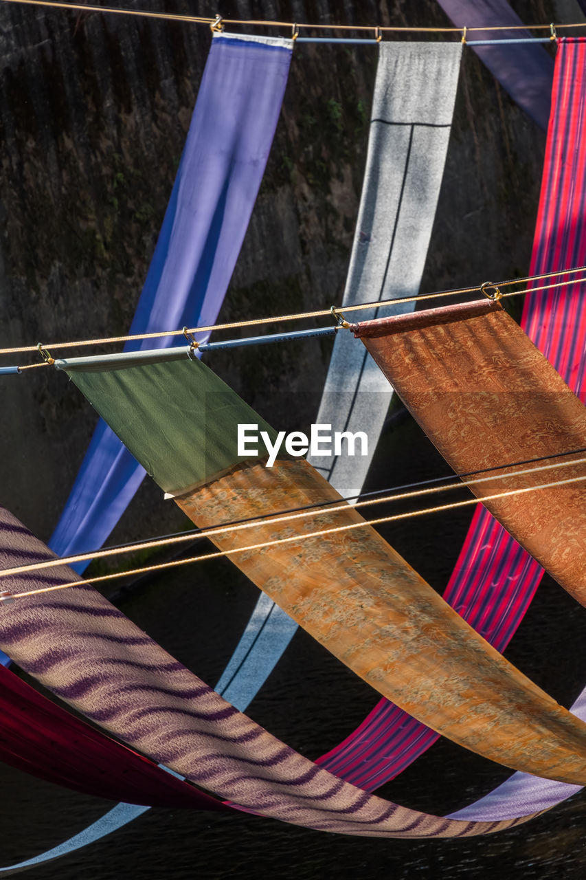 High angle view of fabrics hanging over water