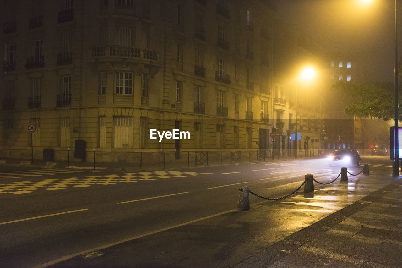 MAN IN CITY AT NIGHT