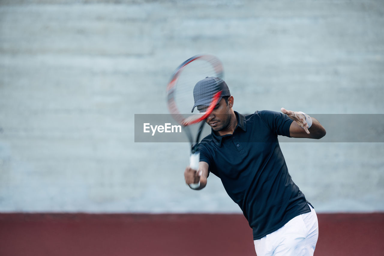 low angle view of man playing tennis