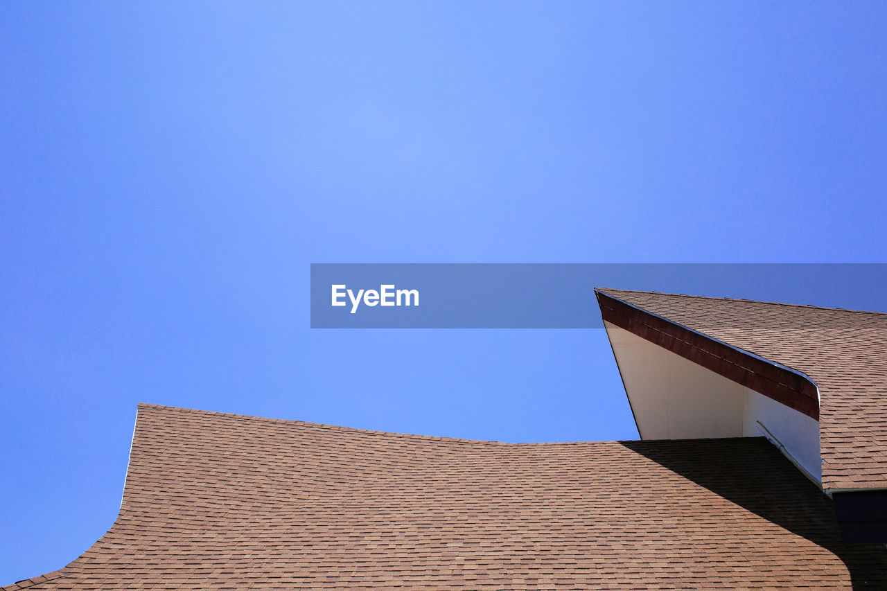 Low angle view of building against blue sky