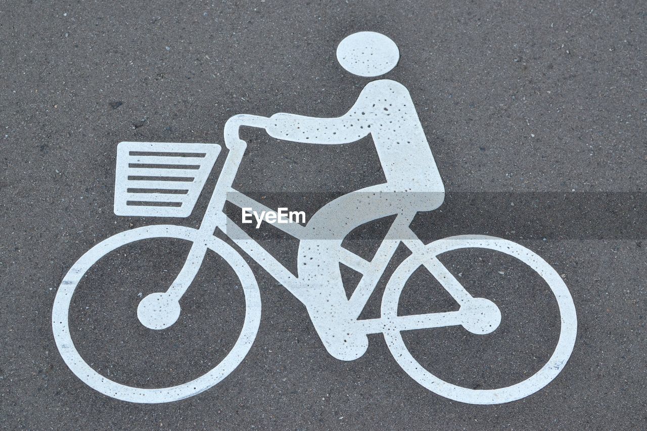 High angle view of bicycle sign on street