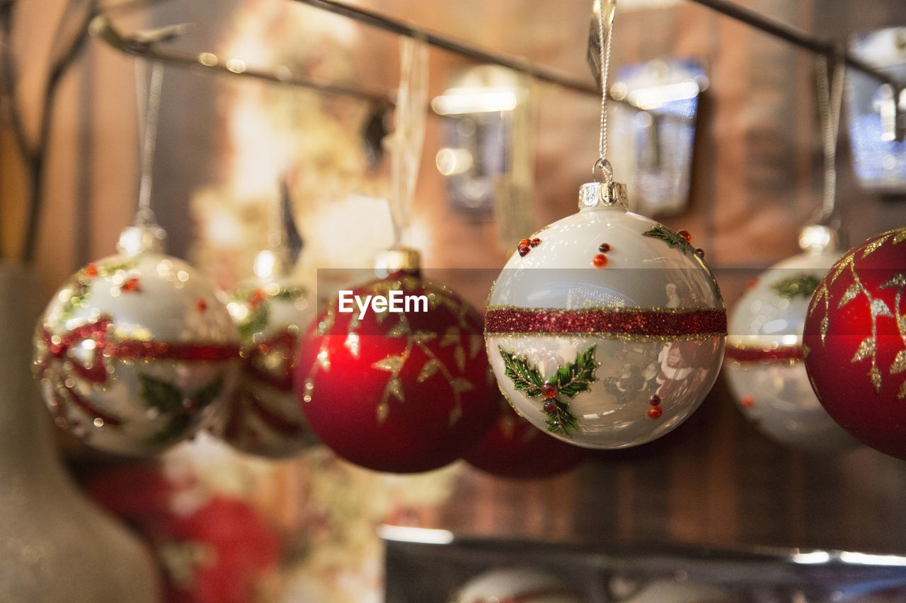 Close-up of christmas ornaments hanging at store