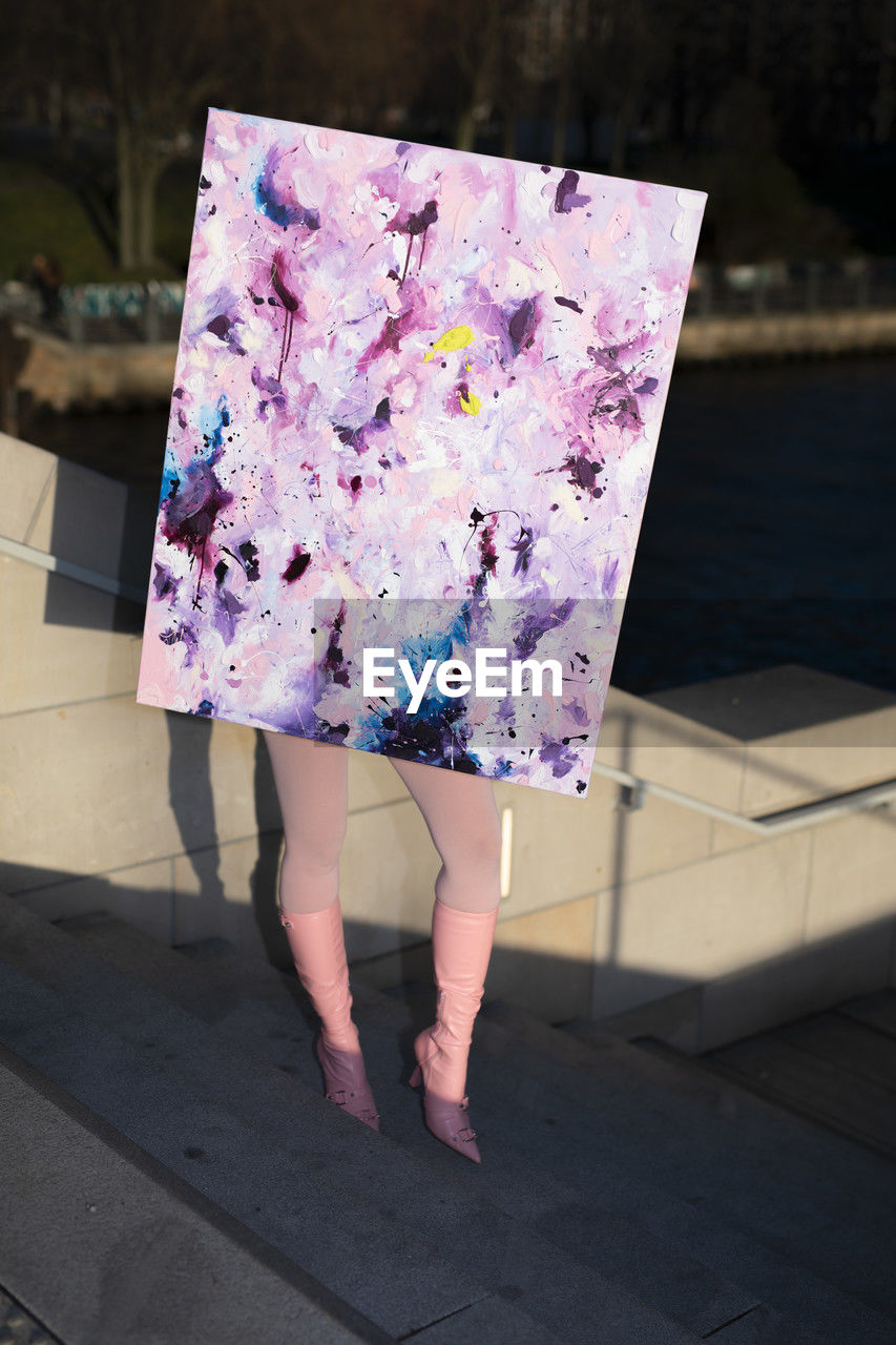 pink, spring, one person, fashion, women, dress, purple, low section, adult, blue, pattern, day, human leg, art, standing, floral pattern, clothing, outdoors, leisure activity, nature, full length, walking, holding, footpath, lifestyles, human limb, flower, limb, city