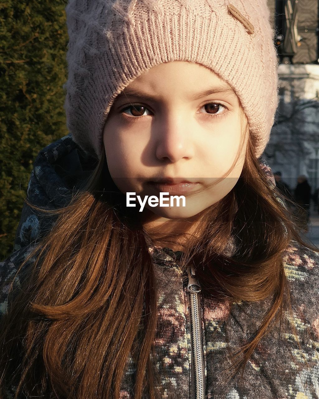 Close-up portrait of cute girl wearing warm clothing