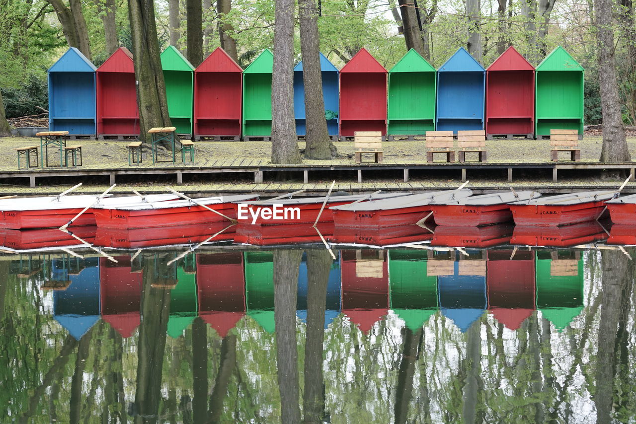 Colorful huts reflecting on calm lake