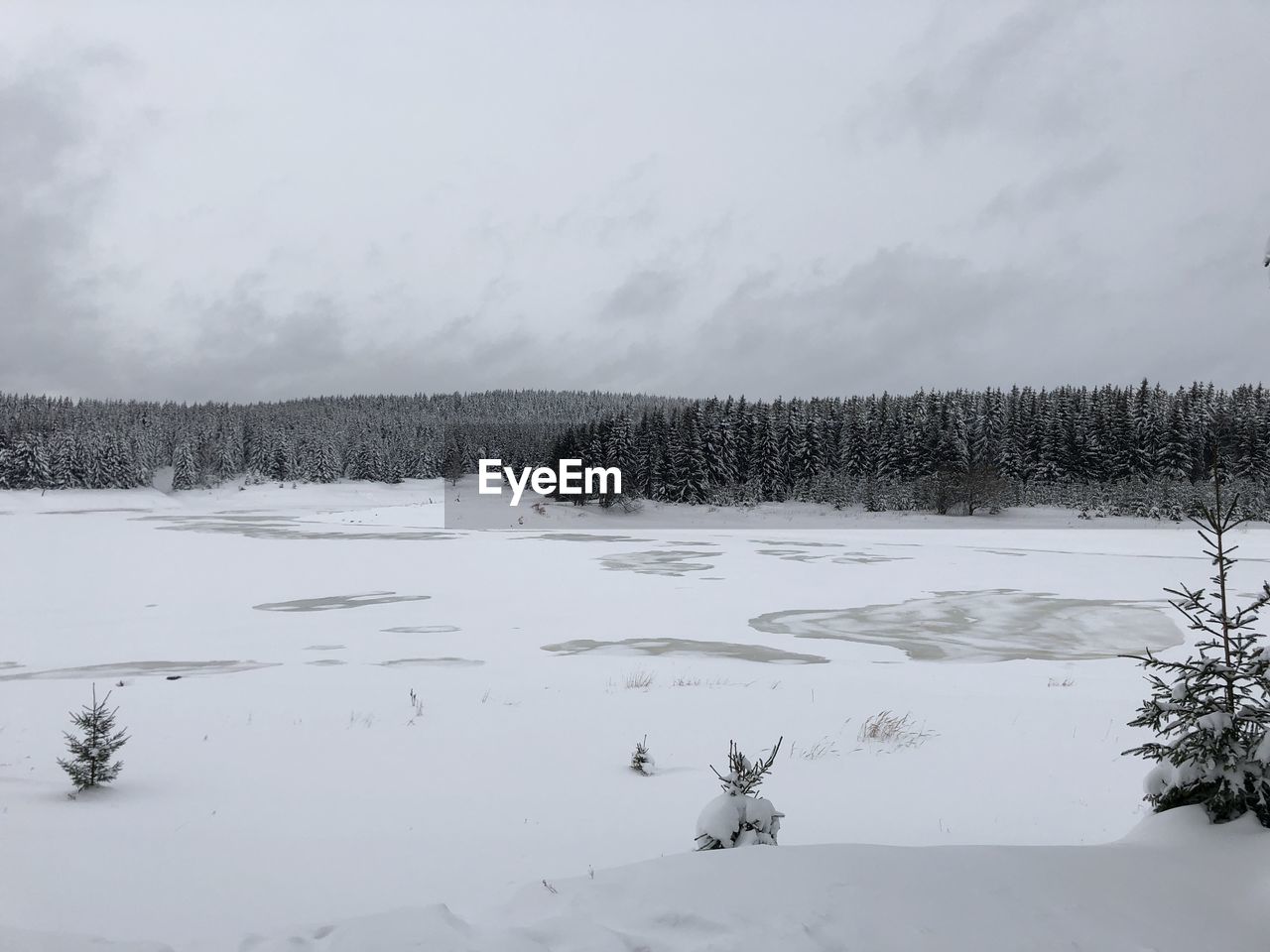 Scenic view of snowcapped landscape against sky