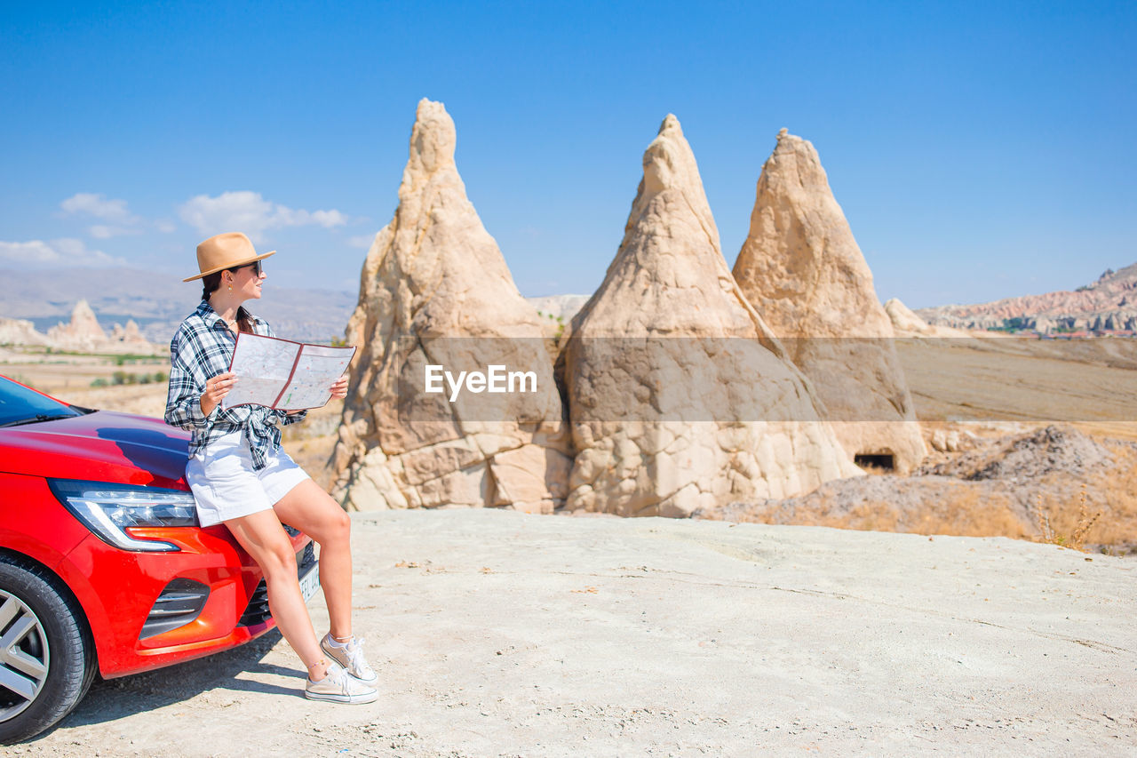 rear view of man riding motorcycle on mountain