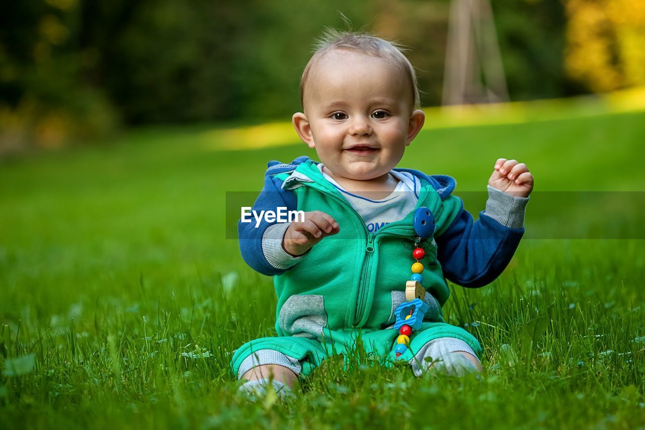 Portrait of smiling boy on grass