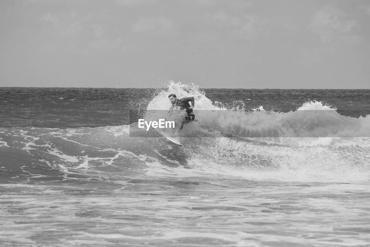 Man surfing on sea