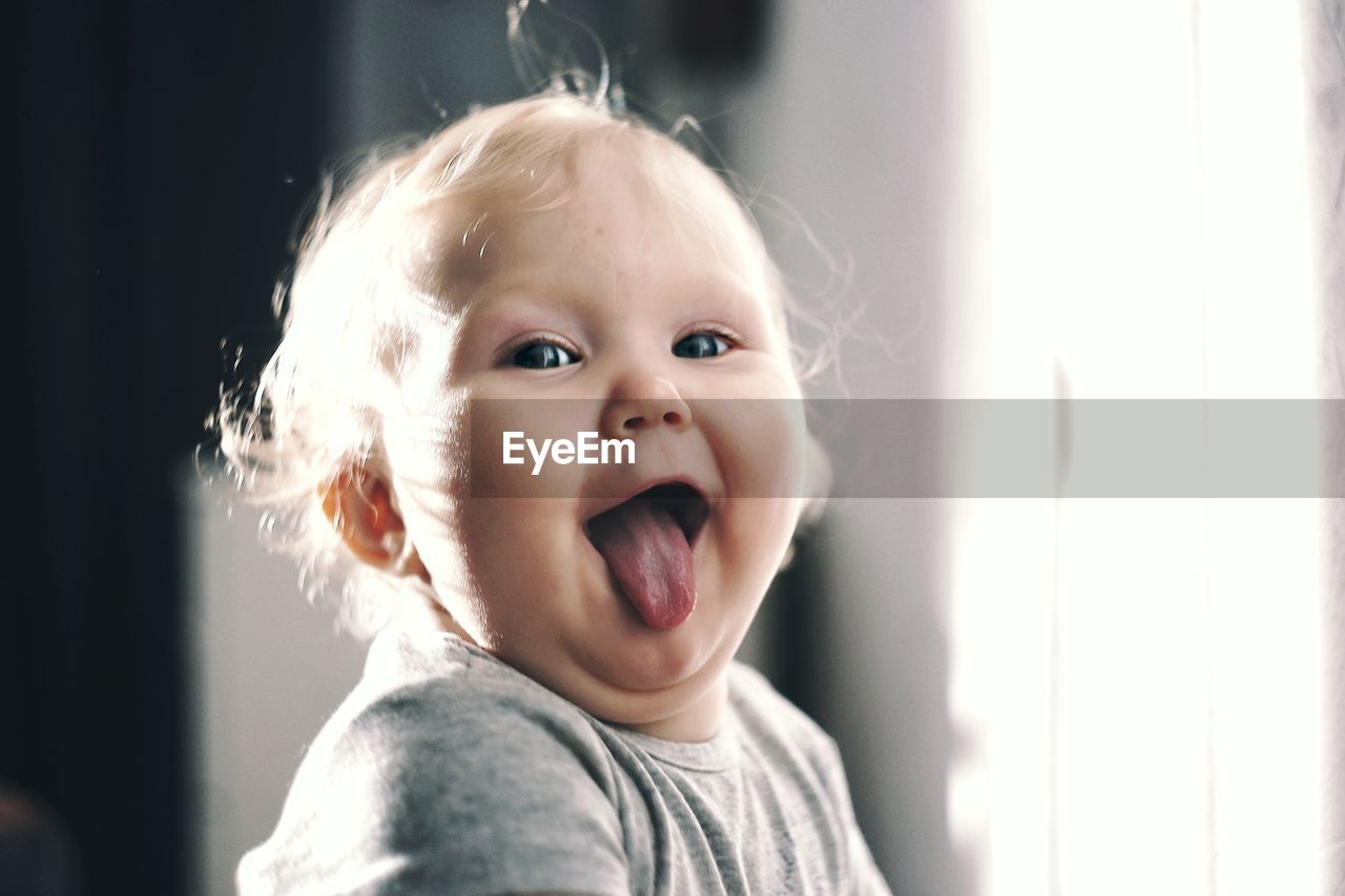 Portrait of cute baby boy at home