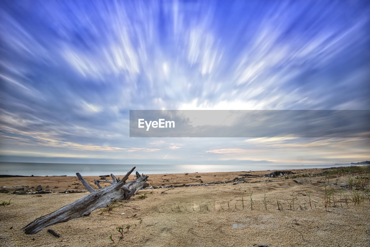 Scenic view of beach against sky