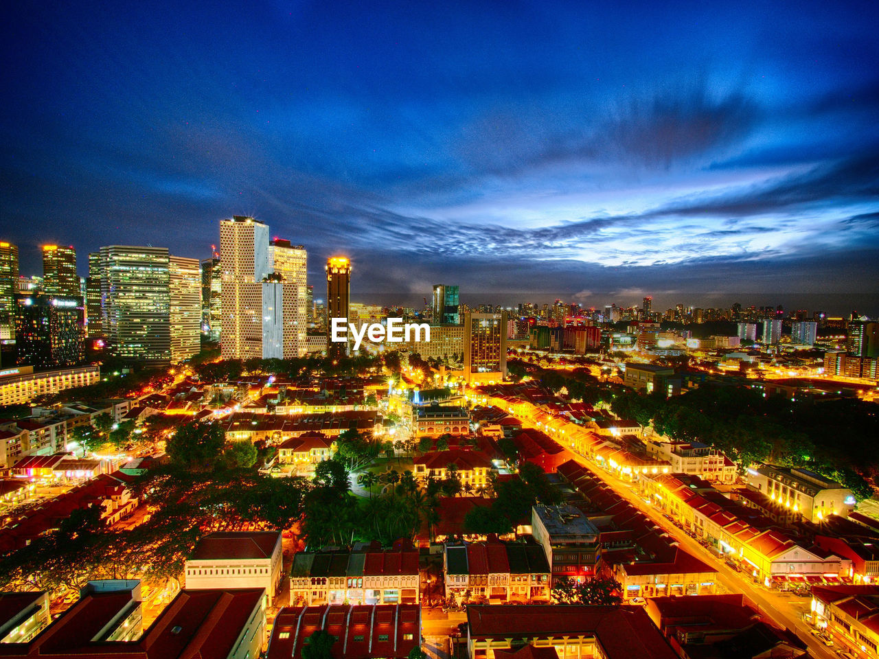 Aerial view of city lit up at night