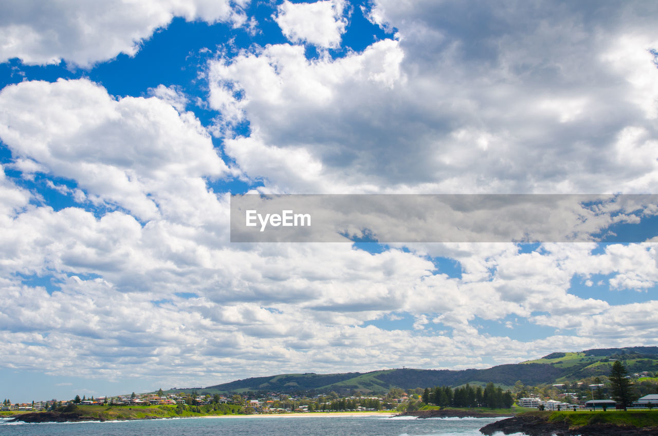 SCENIC VIEW OF CLOUDS OVER MOUNTAINS AGAINST SKY