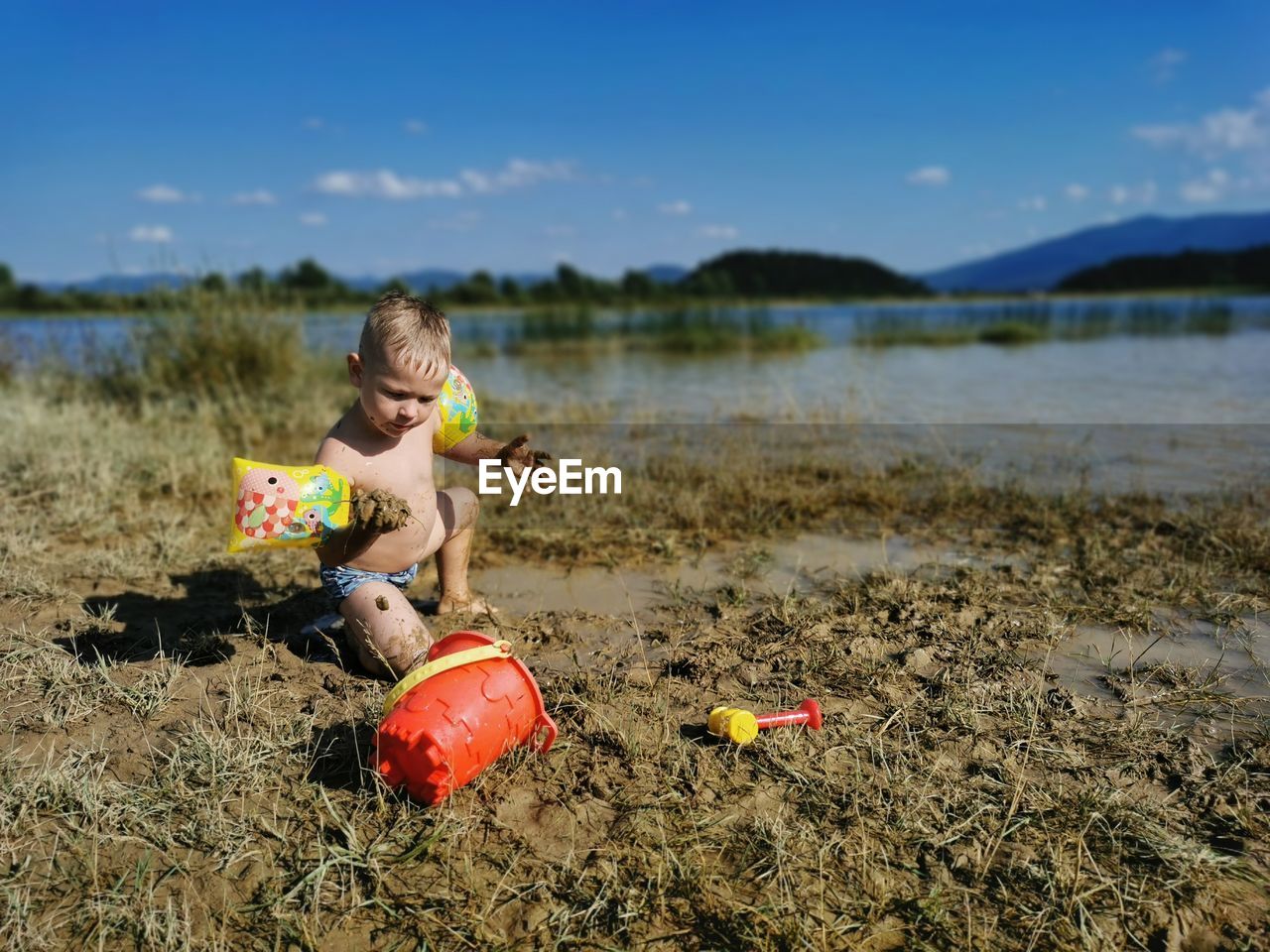 Boy with toy on beach