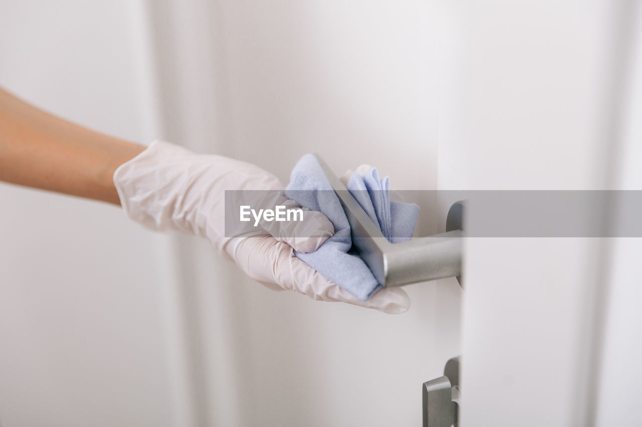 Cropped hand of doctor examining patient at clinic