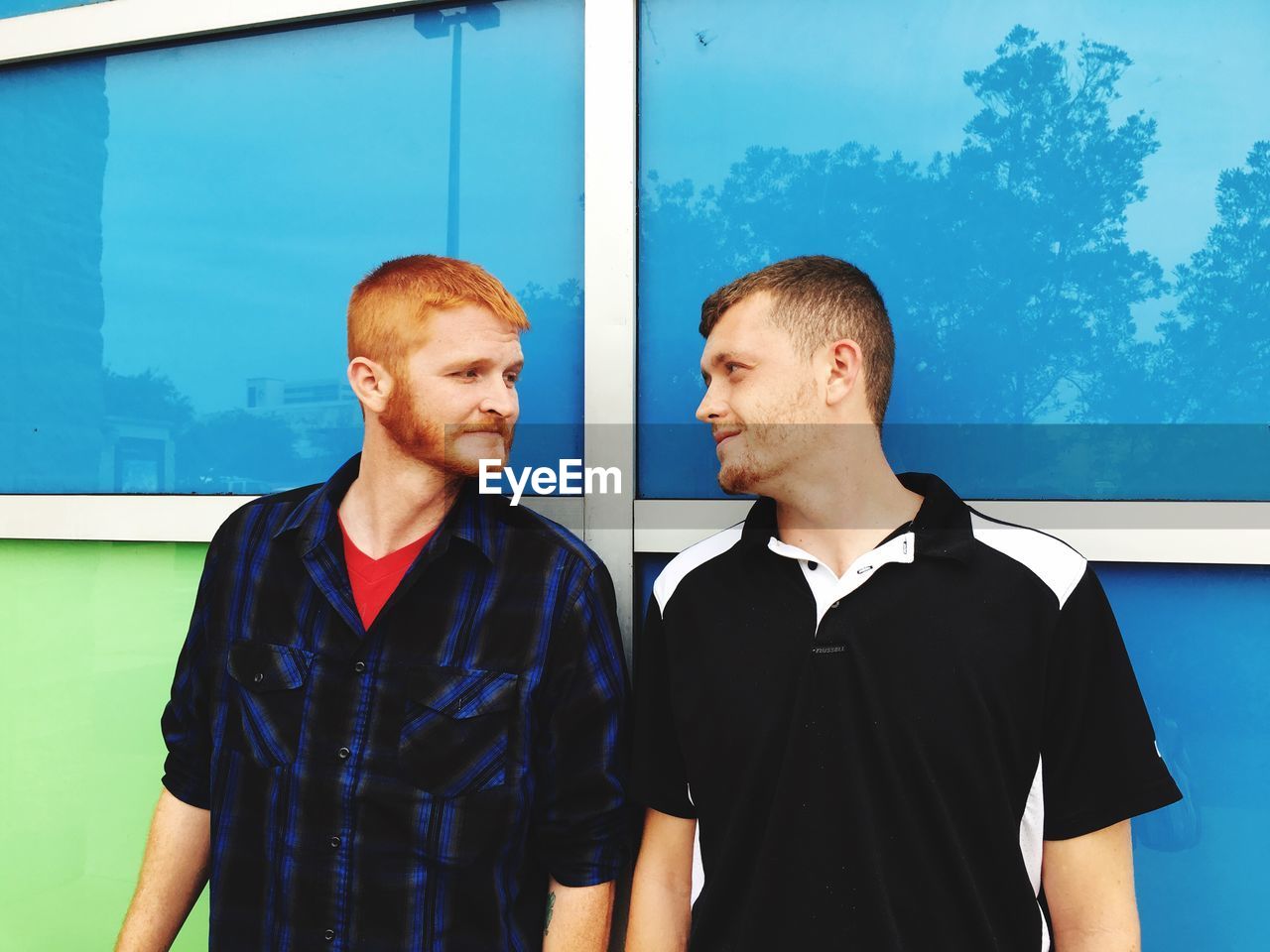 Portrait of young men on street 