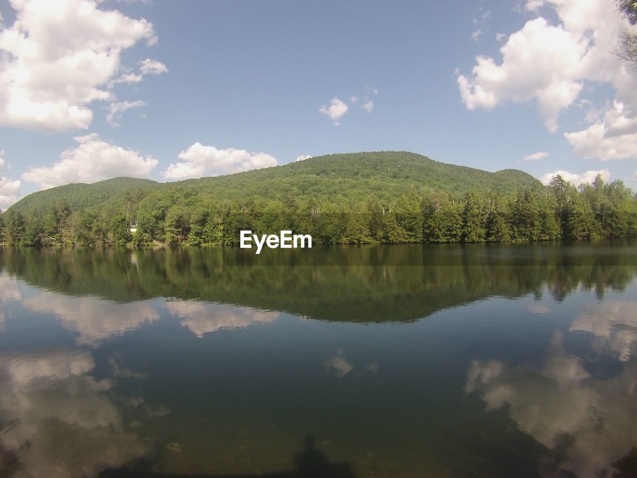 Scenic view of lake against cloudy sky