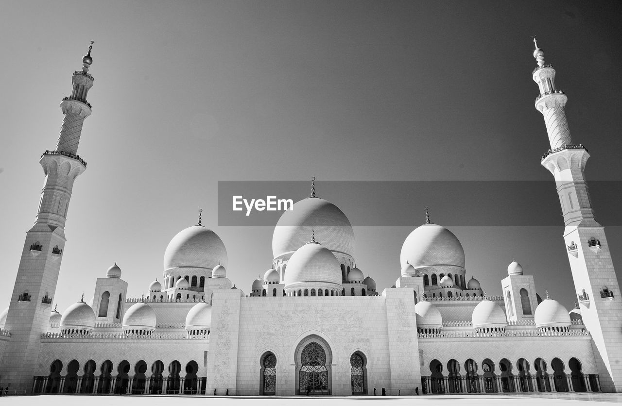 Low angle view of mosque against clear sky