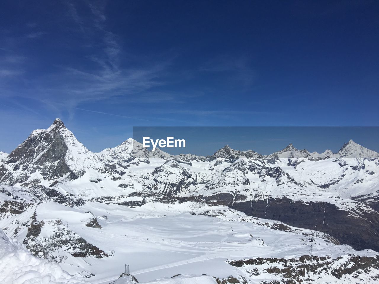 Idyllic shot of snowcapped mountains against sky