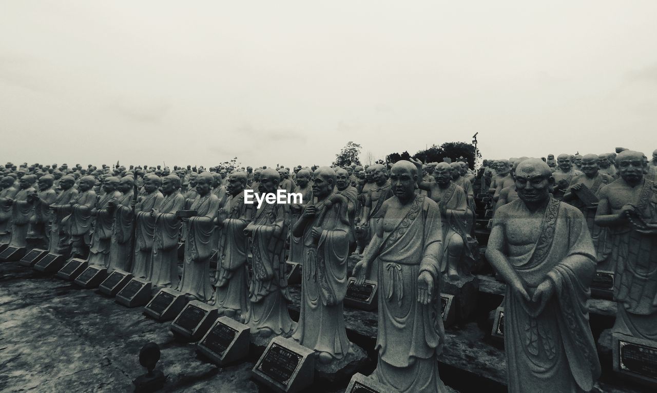 PANORAMIC SHOT OF SCULPTURES AGAINST SKY