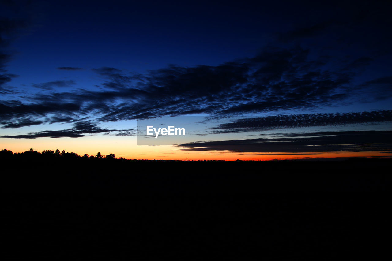 SILHOUETTE LANDSCAPE AGAINST SKY AT SUNSET